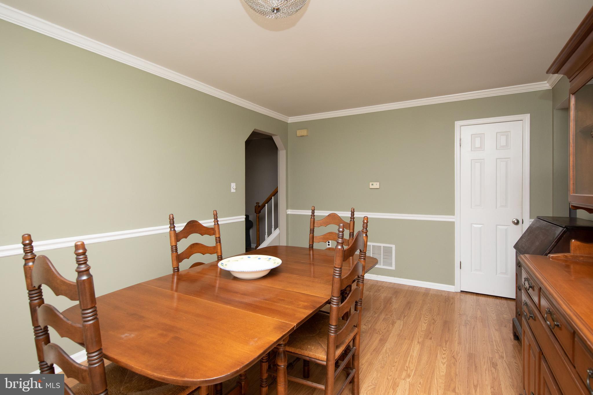 2086 Fort Bevon Road Harleysville, PA 19438 - Photo 7 of 24 a view of a dining room with furniture and wooden floor
