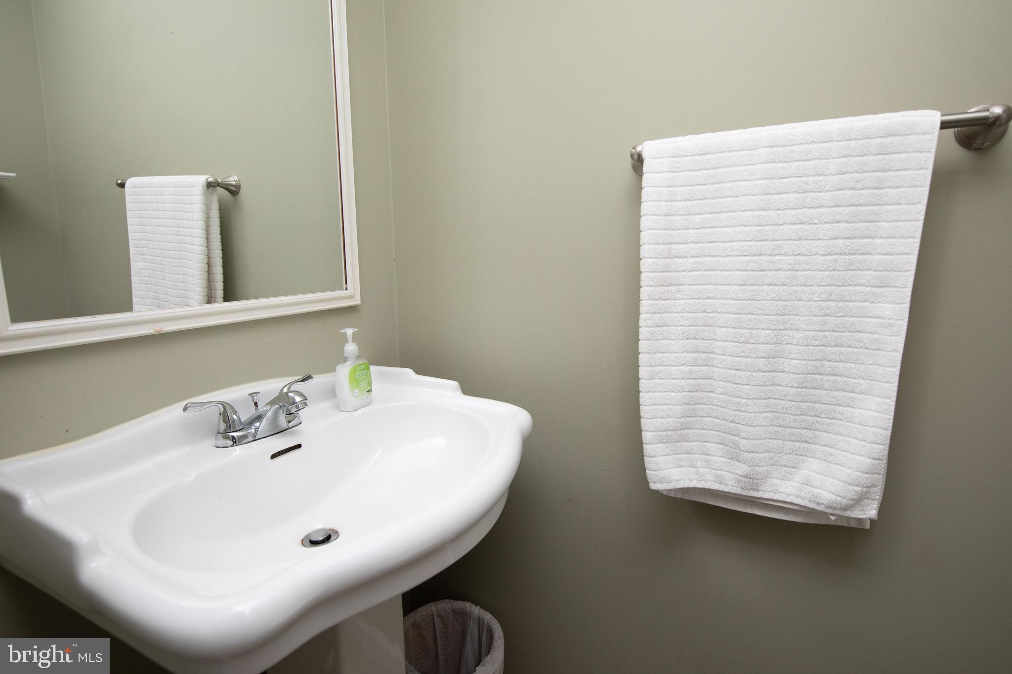 2086 Fort Bevon Road Harleysville, PA 19438 - Photo 8 of 24 a bathroom with a sink a mirror and a window