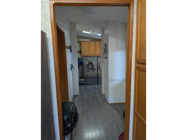 a kitchen with stainless steel appliances granite countertop a sink refrigerator and microwave