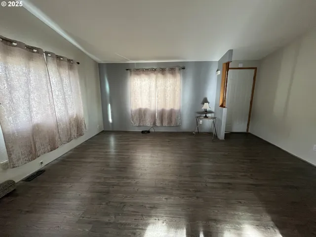 a kitchen with stainless steel appliances granite countertop a refrigerator a stove a sink and a refrigerator