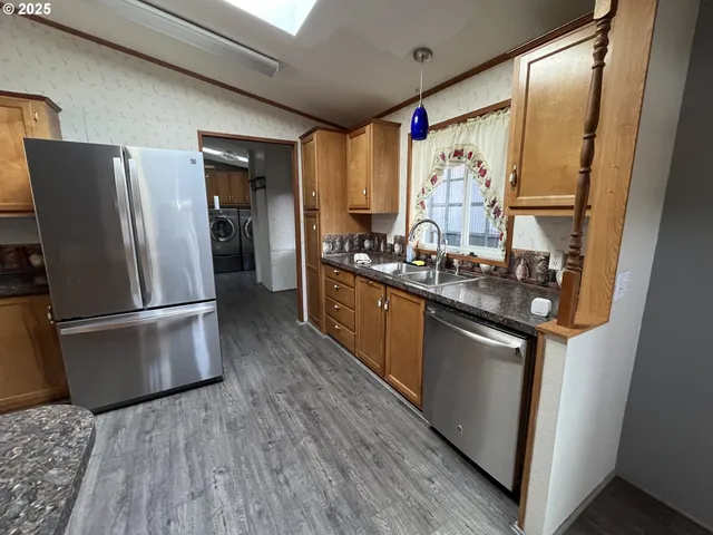 a kitchen with a stove and a microwave