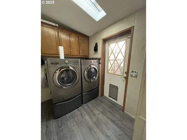 a view of living room with furniture and a fireplace