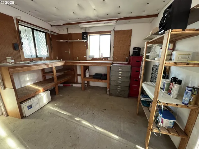 a view of a livingroom with furniture and windows