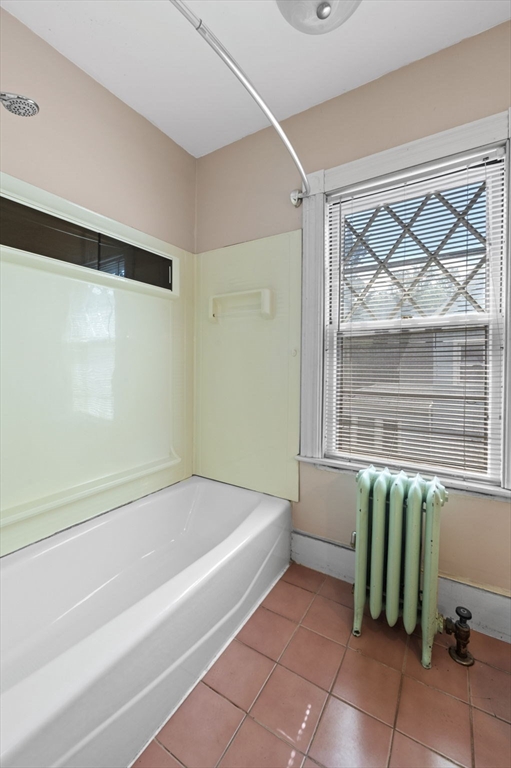 366 Cabot Street Beverly, MA 01915 - Photo 30 of 42 a bathroom with a bathtub and a shower