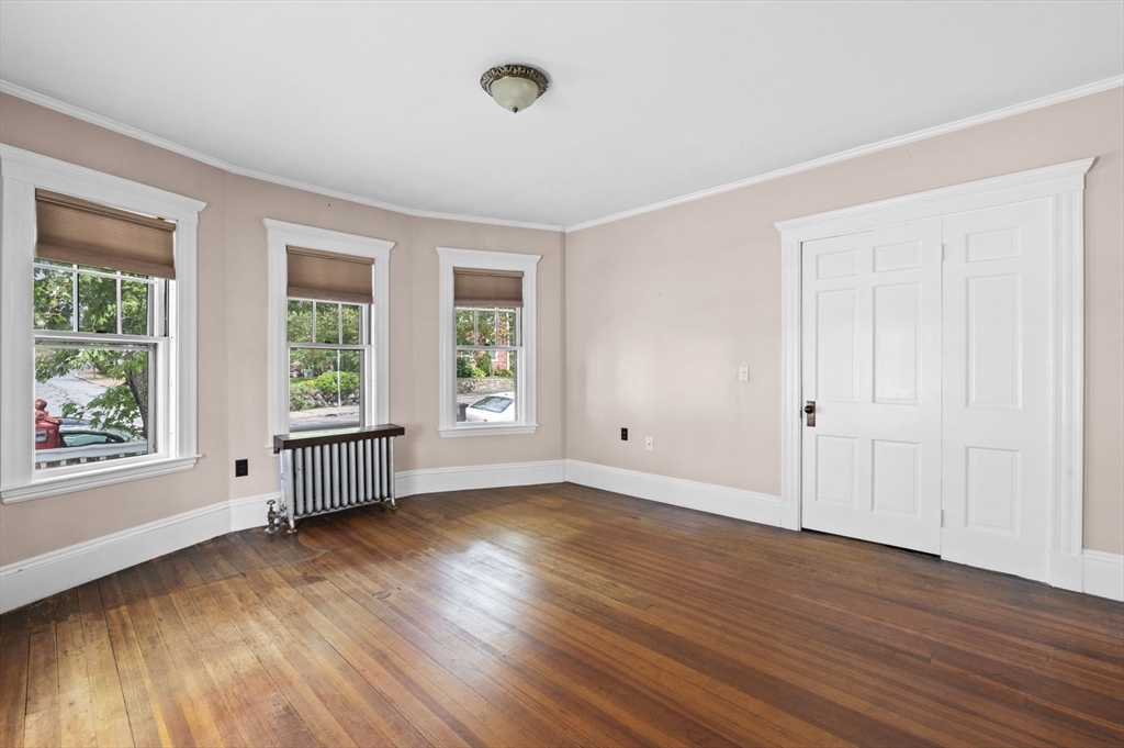 366 Cabot Street Beverly, MA 01915 - Photo 37 of 42 a view of a room with wooden floor and windows