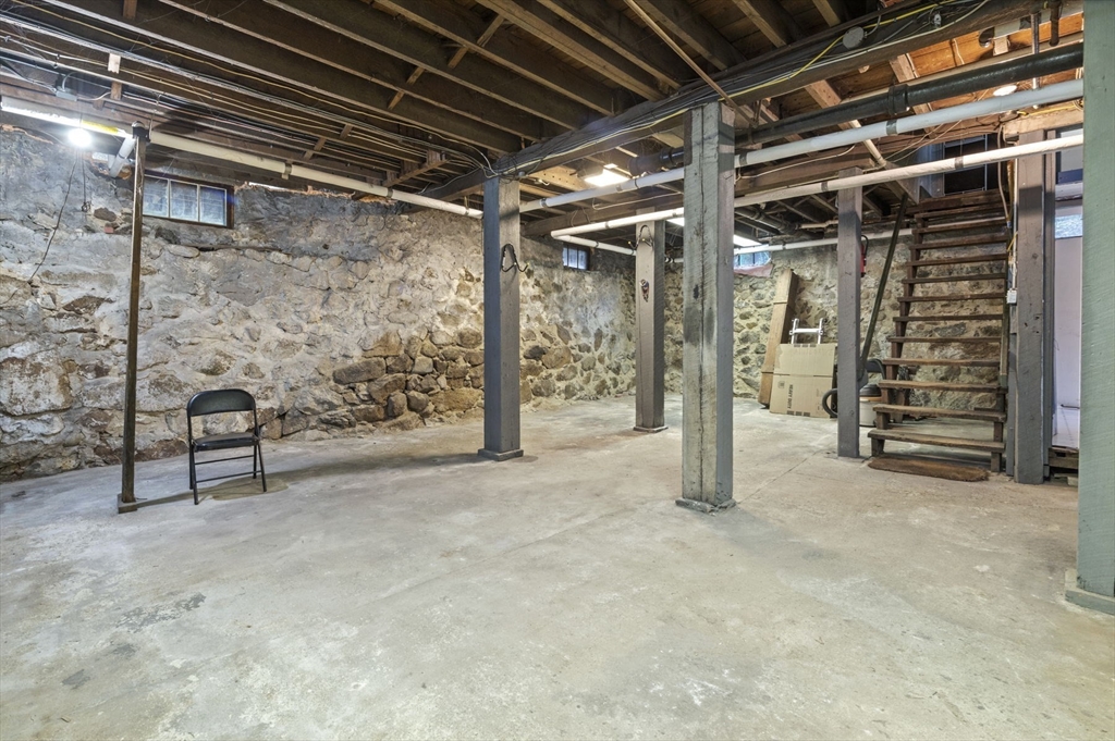 366 Cabot Street Beverly, MA 01915 - Photo 38 of 42 a view of an empty room with stairs