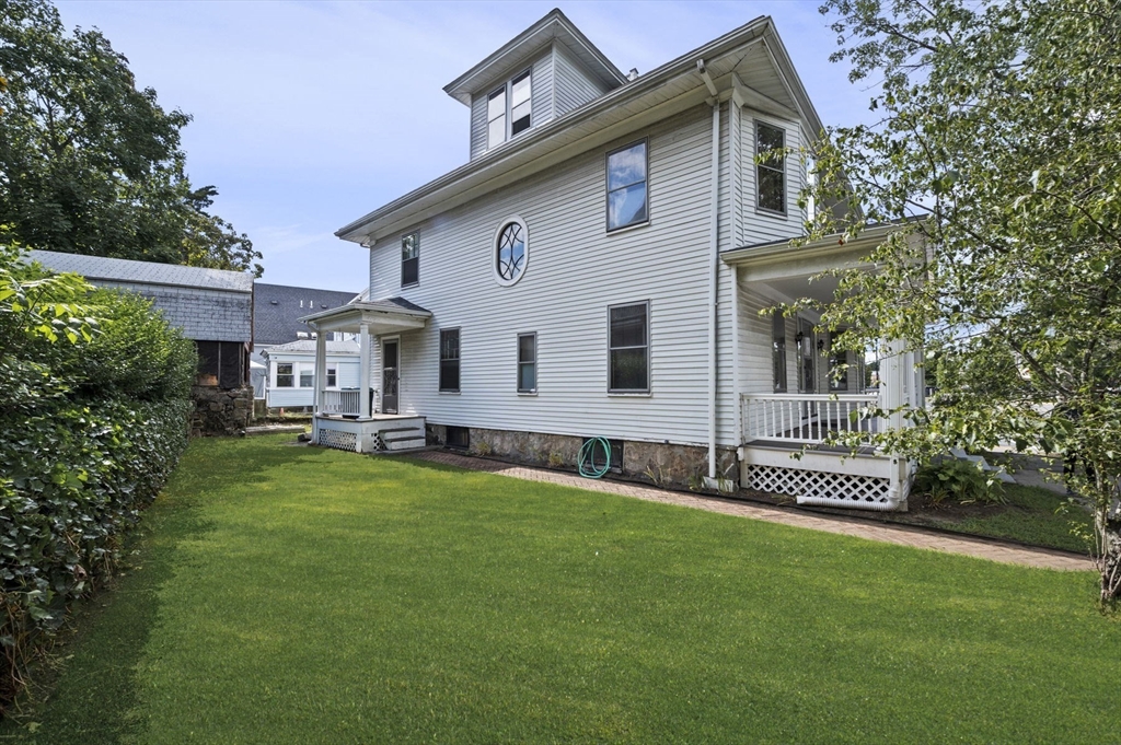 366 Cabot Street Beverly, MA 01915 - Photo 6 of 42 a front view of a house with a garden