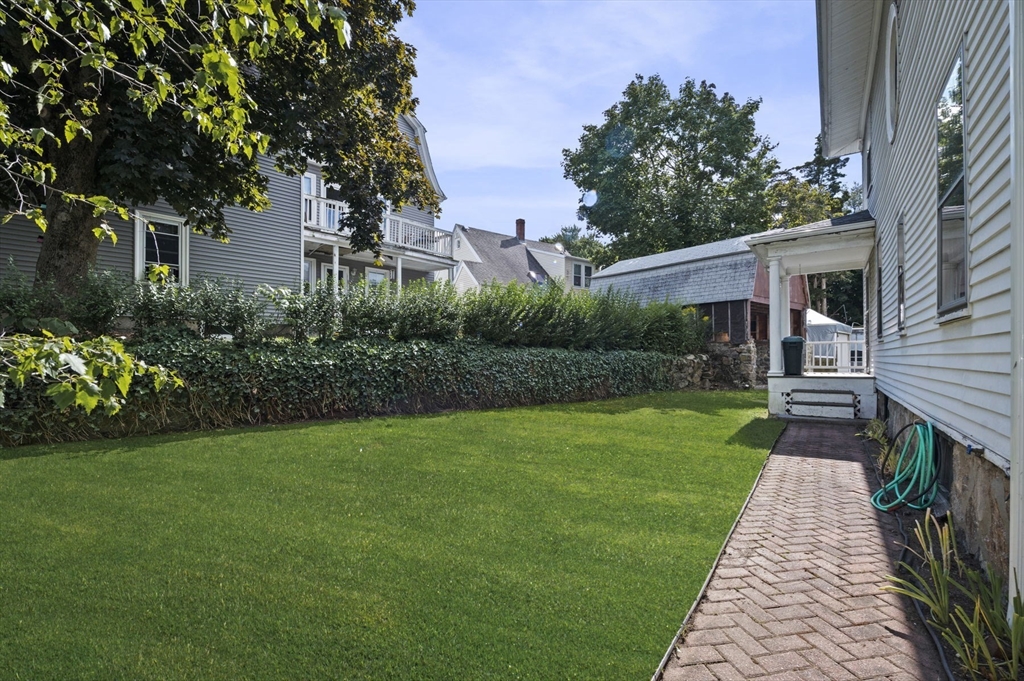 366 Cabot Street Beverly, MA 01915 - Photo 7 of 42 a front view of a house with garden