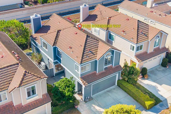 a aerial view of a house with a yard