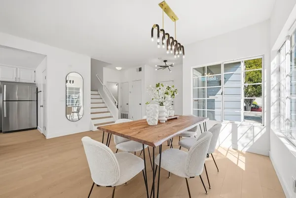 a dining room with furniture and window