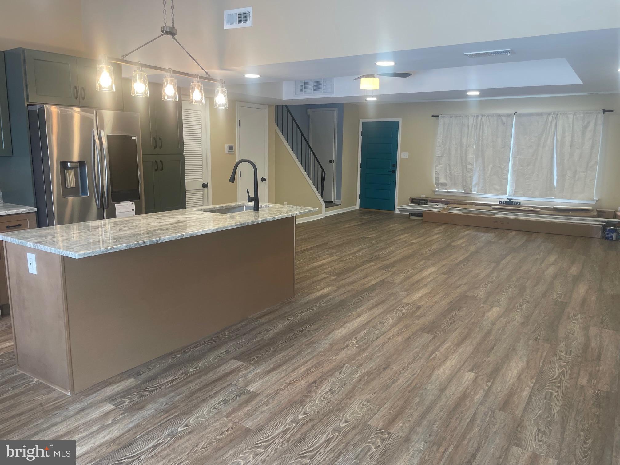 3 Farmhouse Court Sicklerville, NJ 08081 - Photo 4 of 24 a view of a kitchen with a sink and dishwasher with wooden floor