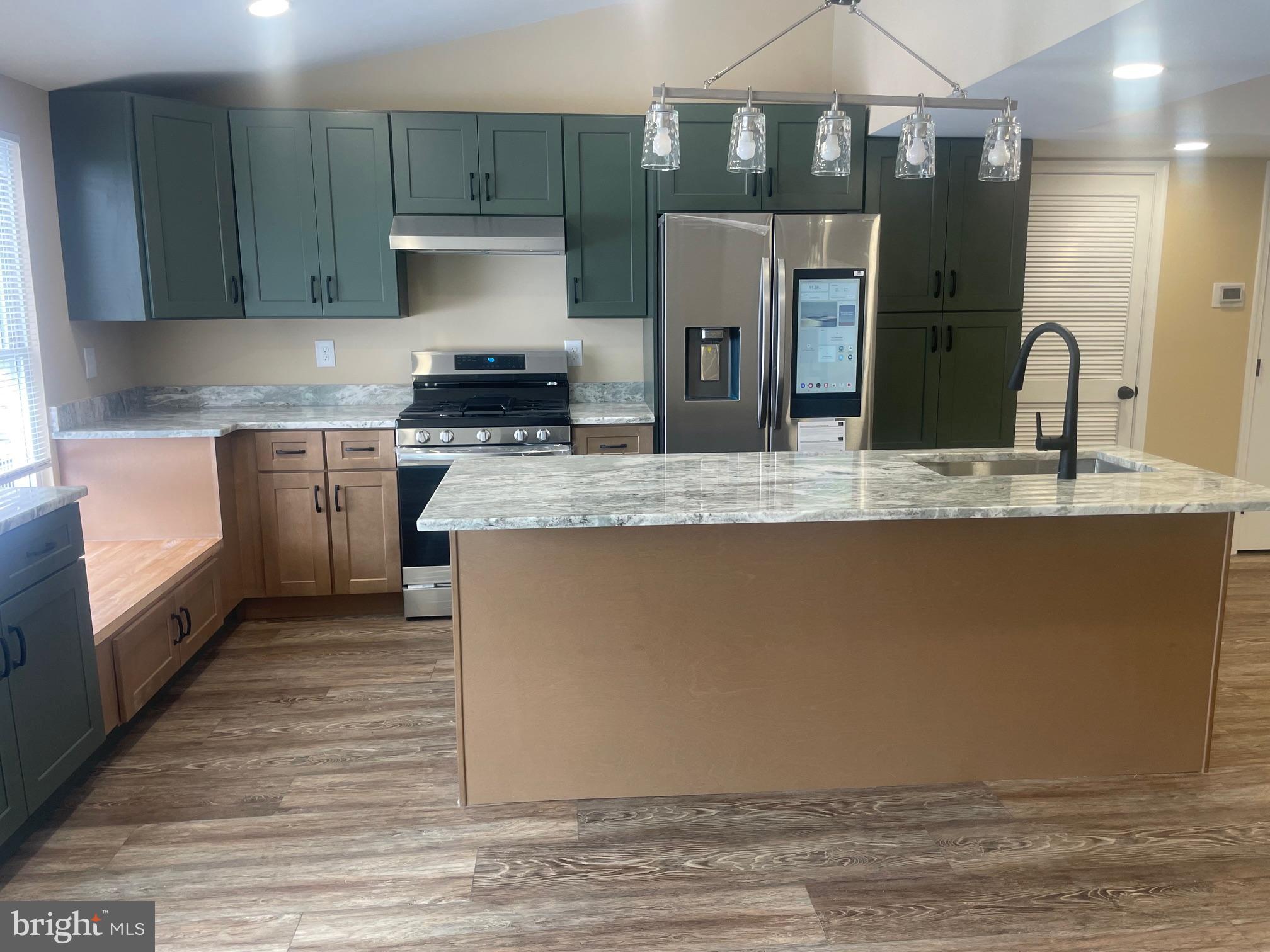 3 Farmhouse Court Sicklerville, NJ 08081 - Photo 6 of 24 a kitchen with a sink and a refrigerator