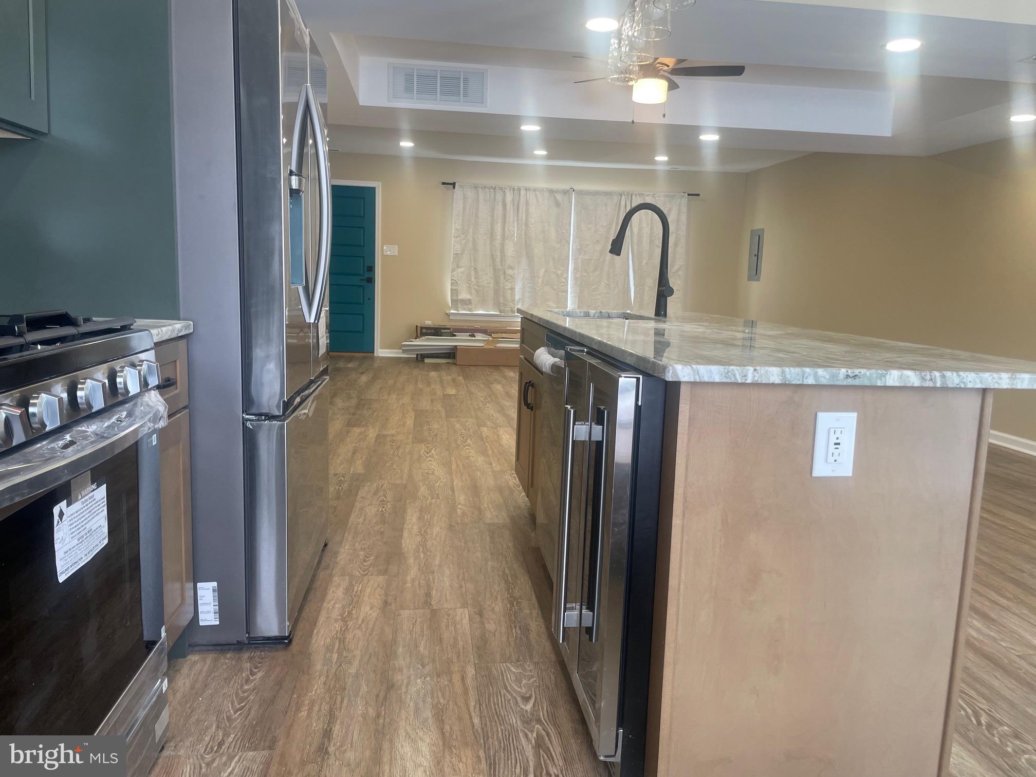 3 Farmhouse Court Sicklerville, NJ 08081 - Photo 8 of 24 a kitchen with kitchen island a counter top space and wooden floor