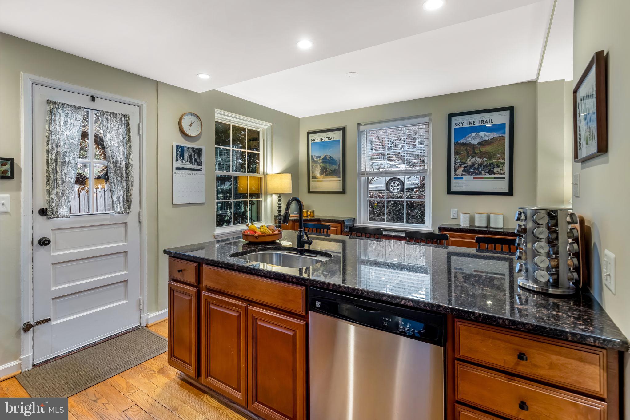 4225 32nd Road South Arlington, VA 22206 - Photo 16 of 36 a kitchen with stainless steel appliances granite countertop a stove and cabinets