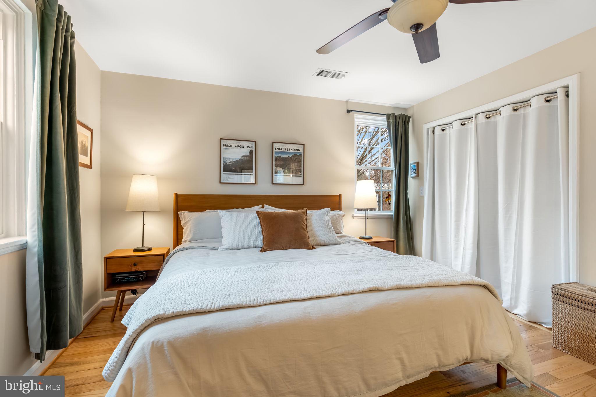 4225 32nd Road South Arlington, VA 22206 - Photo 18 of 36 a bedroom with a large bed and a chandelier