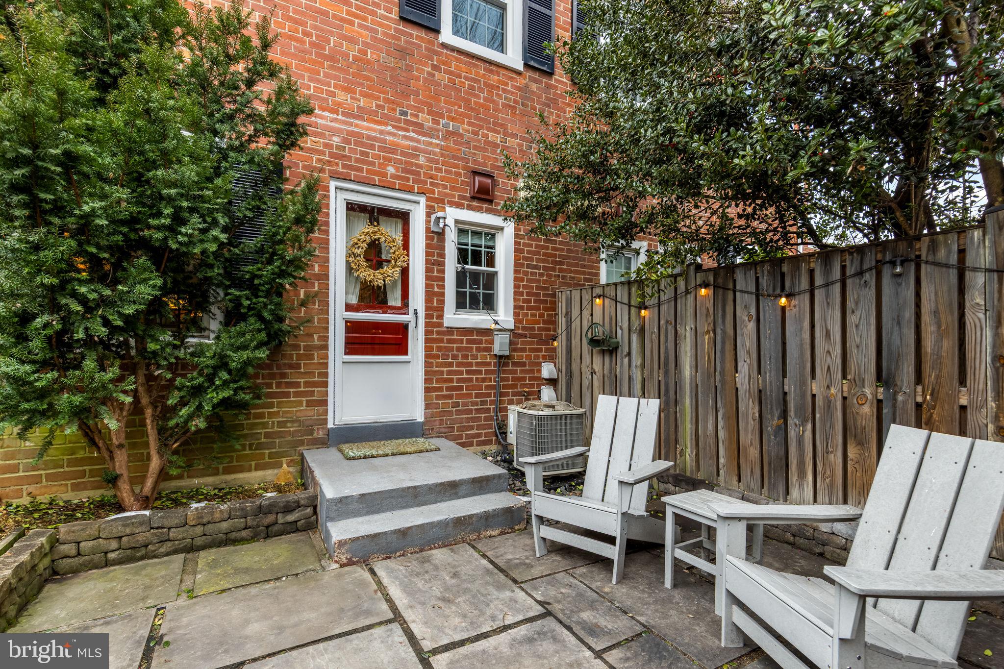 4225 32nd Road South Arlington, VA 22206 - Photo 31 of 36 a wooden bench sitting in front of a building