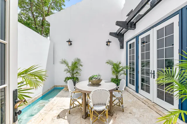 a white toilet sitting next to a shower curtain