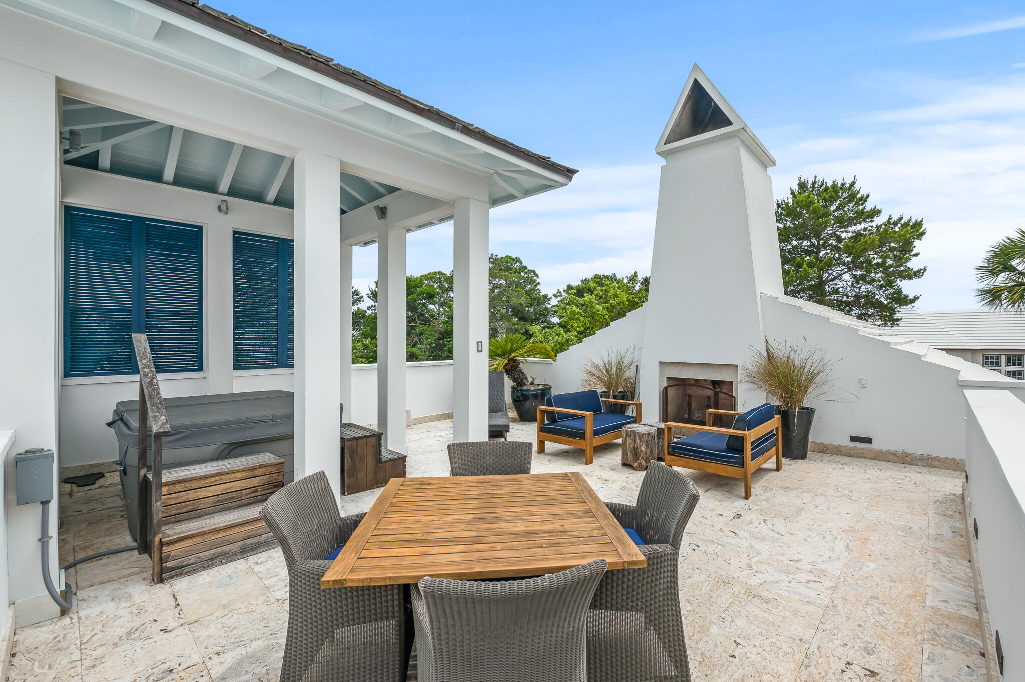 140 North Charles St Inlet Beach Inlet Beach, FL 32461 - Photo 68 of 72 a backyard of a house with barbeque oven table and chairs