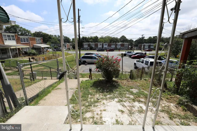 a view of a chair and tables in the patio