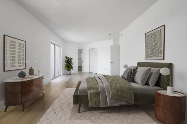 a spacious bedroom with a bed and a couch