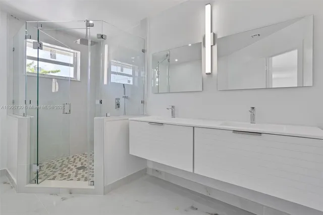 a bathroom with a sink and mirror