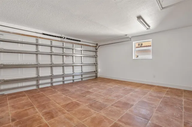 a view of a room with an empty space and a window