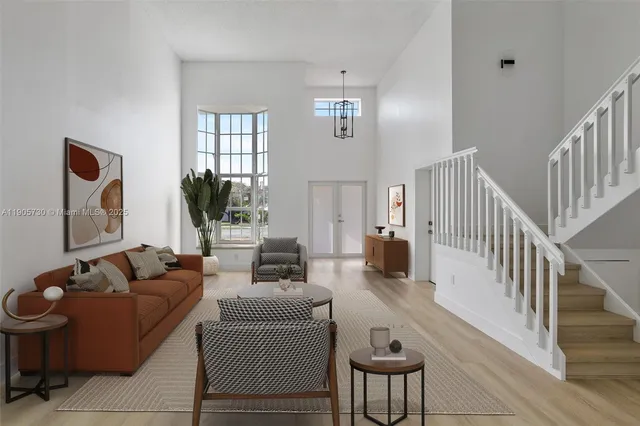 a living room with furniture fireplace and a window