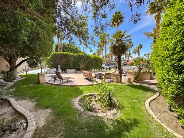 a view of a swimming pool with a garden