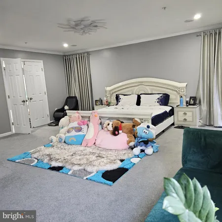 a bedroom with a bed and mirror