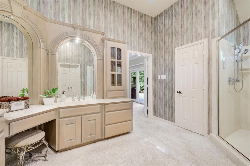 2740 High Road Flower Mound, TX 75022 - Photo 16 of 35 a en suite bathroom with a double vanity sink a large mirror and a shower