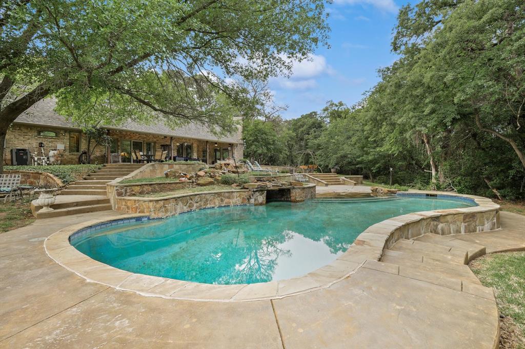 2740 High Road Flower Mound, TX 75022 - Photo 27 of 35 a view of a house with swimming pool