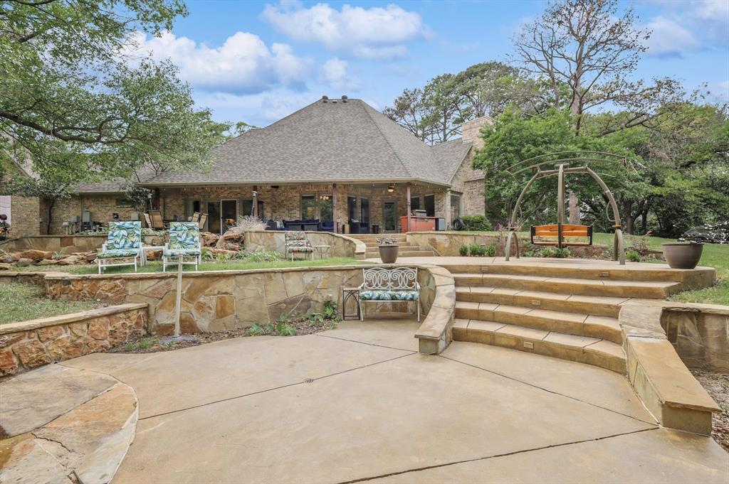 2740 High Road Flower Mound, TX 75022 - Photo 29 of 35 a view of a white house with a large trees