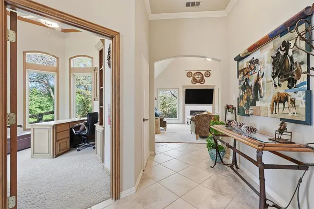 a living room with furniture large window and flat screen tv