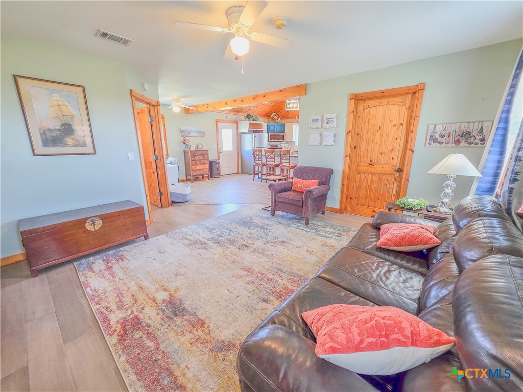 376 Haddock Drive Palacios, TX 77465 - Photo 15 of 41 a bedroom with furniture and wooden floor