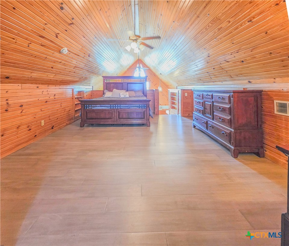 376 Haddock Drive Palacios, TX 77465 - Photo 25 of 41 a view of a room with wooden cabinets