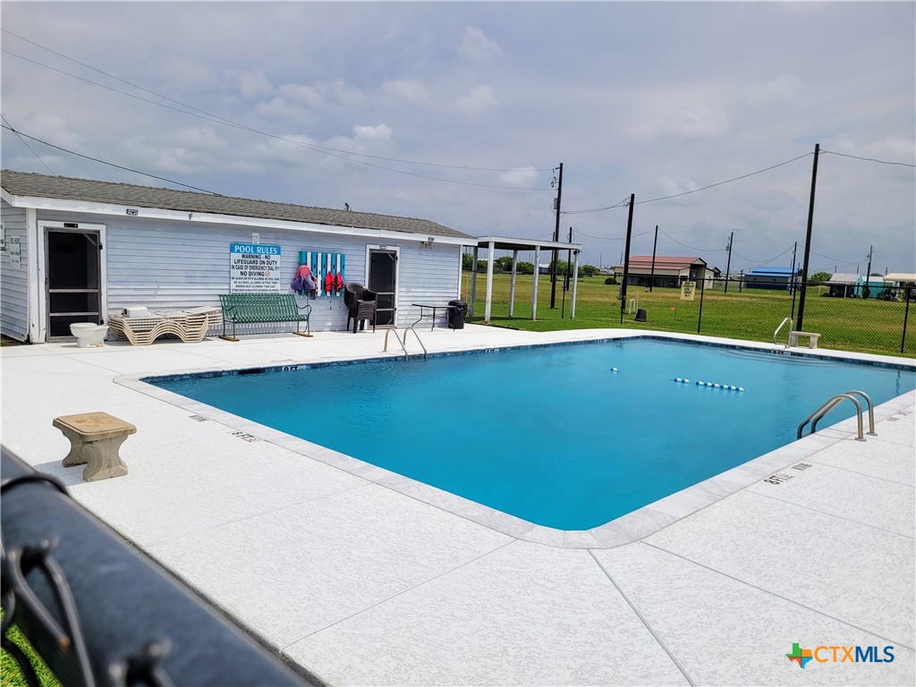 376 Haddock Drive Palacios, TX 77465 - Photo 31 of 41 a view of swimming pool with chairs