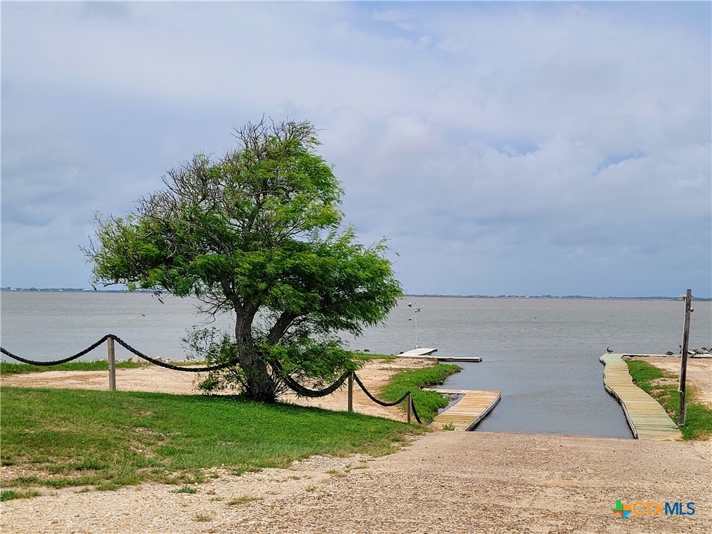 376 Haddock Drive Palacios, TX 77465 - Photo 33 of 41 a view of a lake with a yard