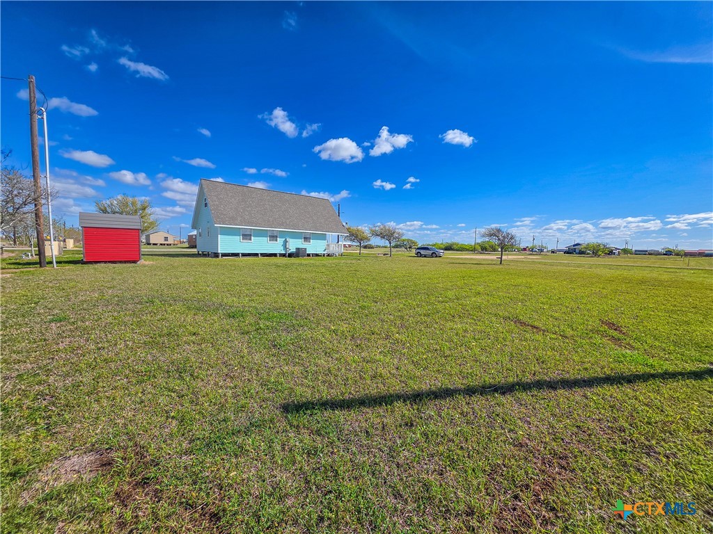 376 Haddock Drive Palacios, TX 77465 - Photo 37 of 41 a view of an ocean and a yard