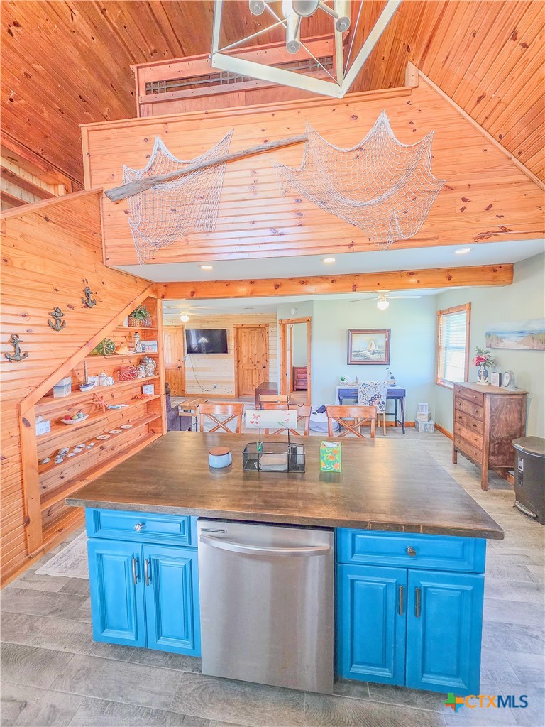 376 Haddock Drive Palacios, TX 77465 - Photo 7 of 41 a kitchen with stainless steel appliances granite countertop a sink and cabinets