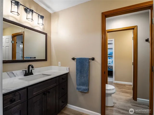 a bathroom with a sink a mirror and a shower