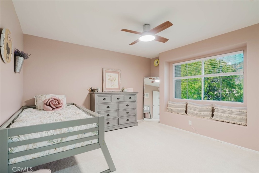 32480 The Old Road Castaic, CA 91384 - Photo 31 of 68 a bedroom with a large bed and a large window