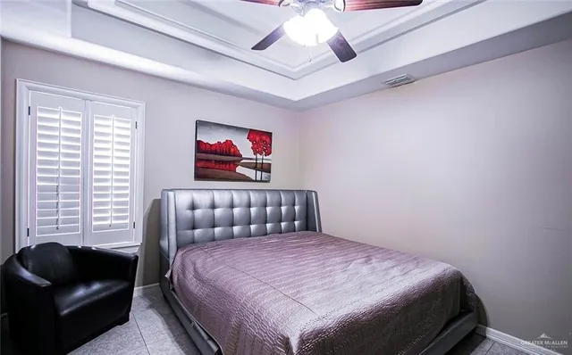 a bedroom with a bed and a couch