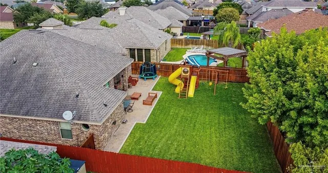 an aerial view of a house with a garden