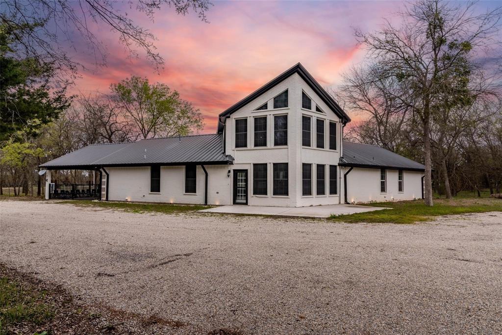 16301 Highway 121 Blue Ridge, TX 75424 - Photo 1 of 27 a front view of a house with a yard