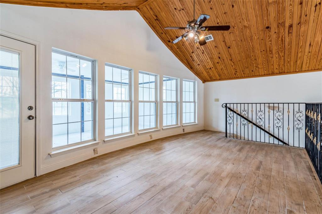 16301 Highway 121 Blue Ridge, TX 75424 - Photo 14 of 27 a view of an empty room with a window and wooden floor