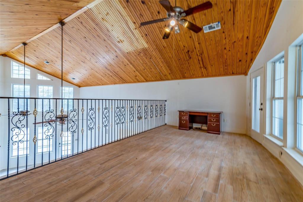 16301 Highway 121 Blue Ridge, TX 75424 - Photo 15 of 27 a view of an empty room with wooden floor