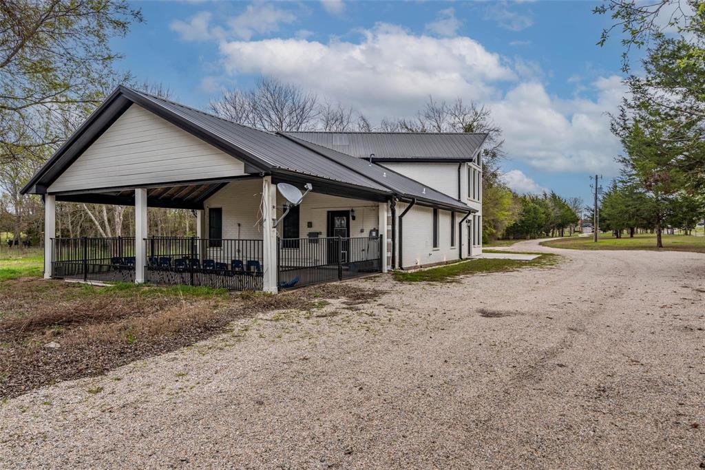 16301 Highway 121 Blue Ridge, TX 75424 - Photo 25 of 27 a view of a house with backyard and trees