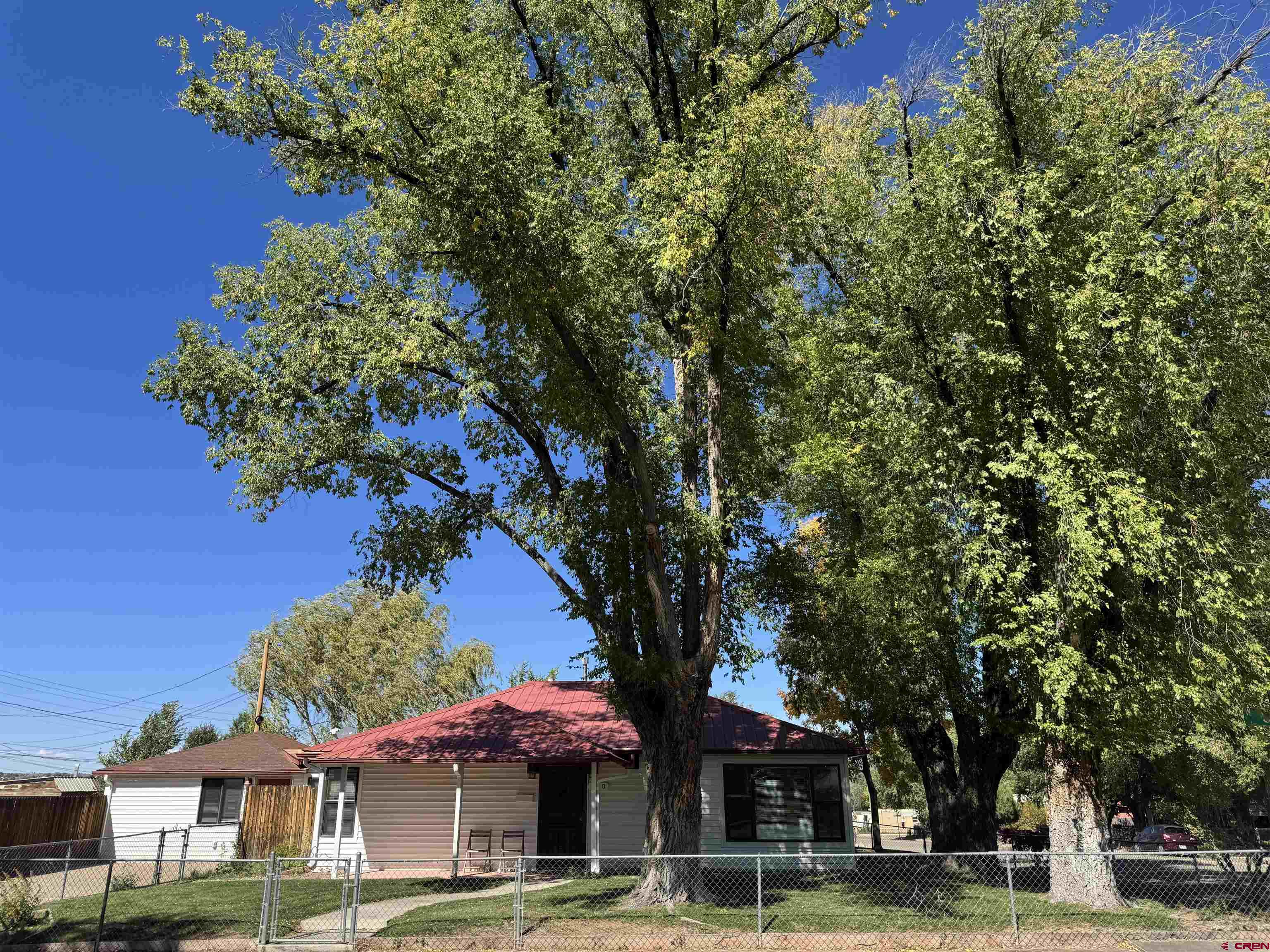 210 West Coronado Avenue Cortez, CO 81321 - Photo 1 of 41 a front view of a building with tree s