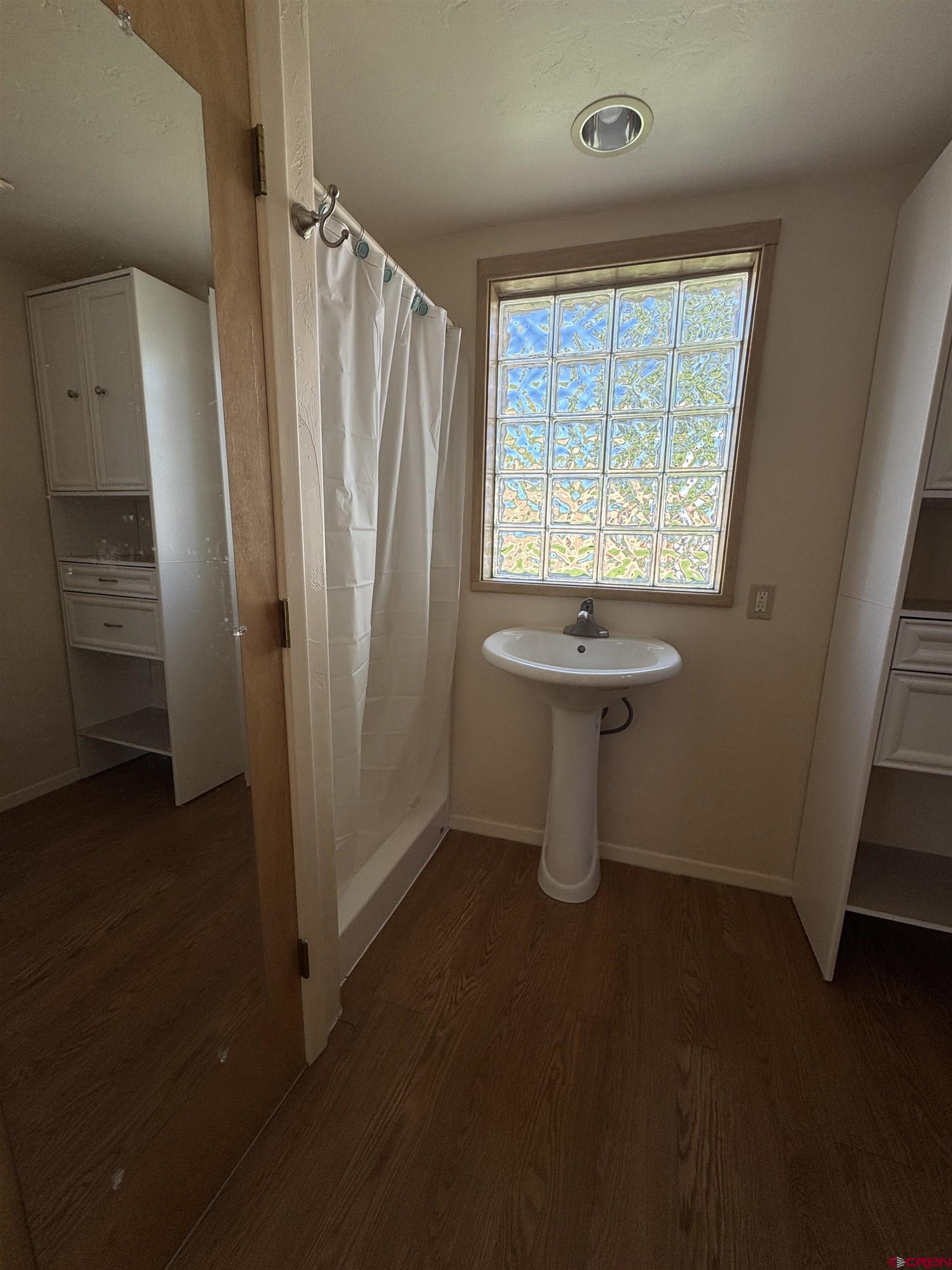 210 West Coronado Avenue Cortez, CO 81321 - Photo 19 of 41 an empty room with a door