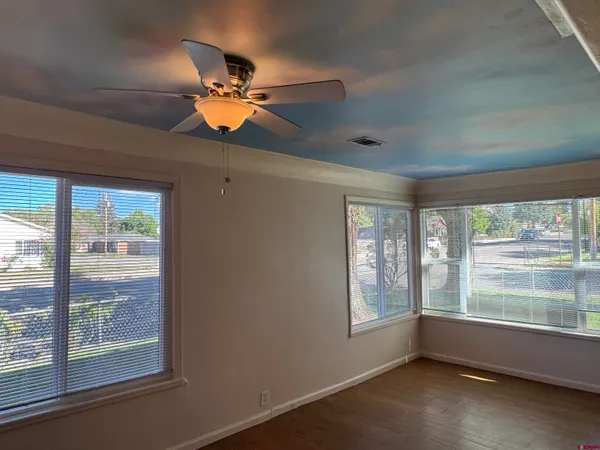 a room with furniture and a large window